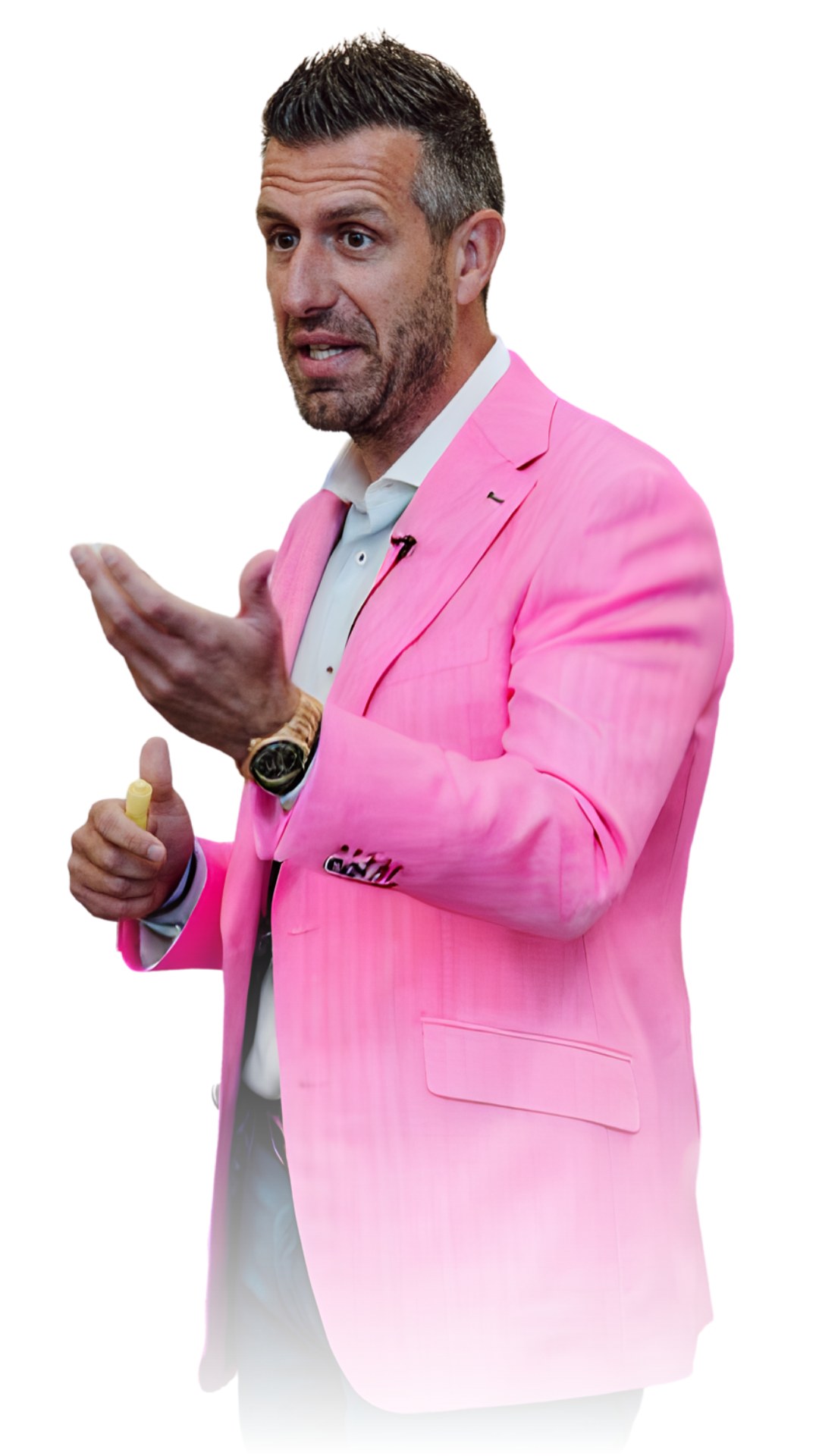 Brandon Mulrenin, Reverse Selling coach, speaking on camera in a pink blazer